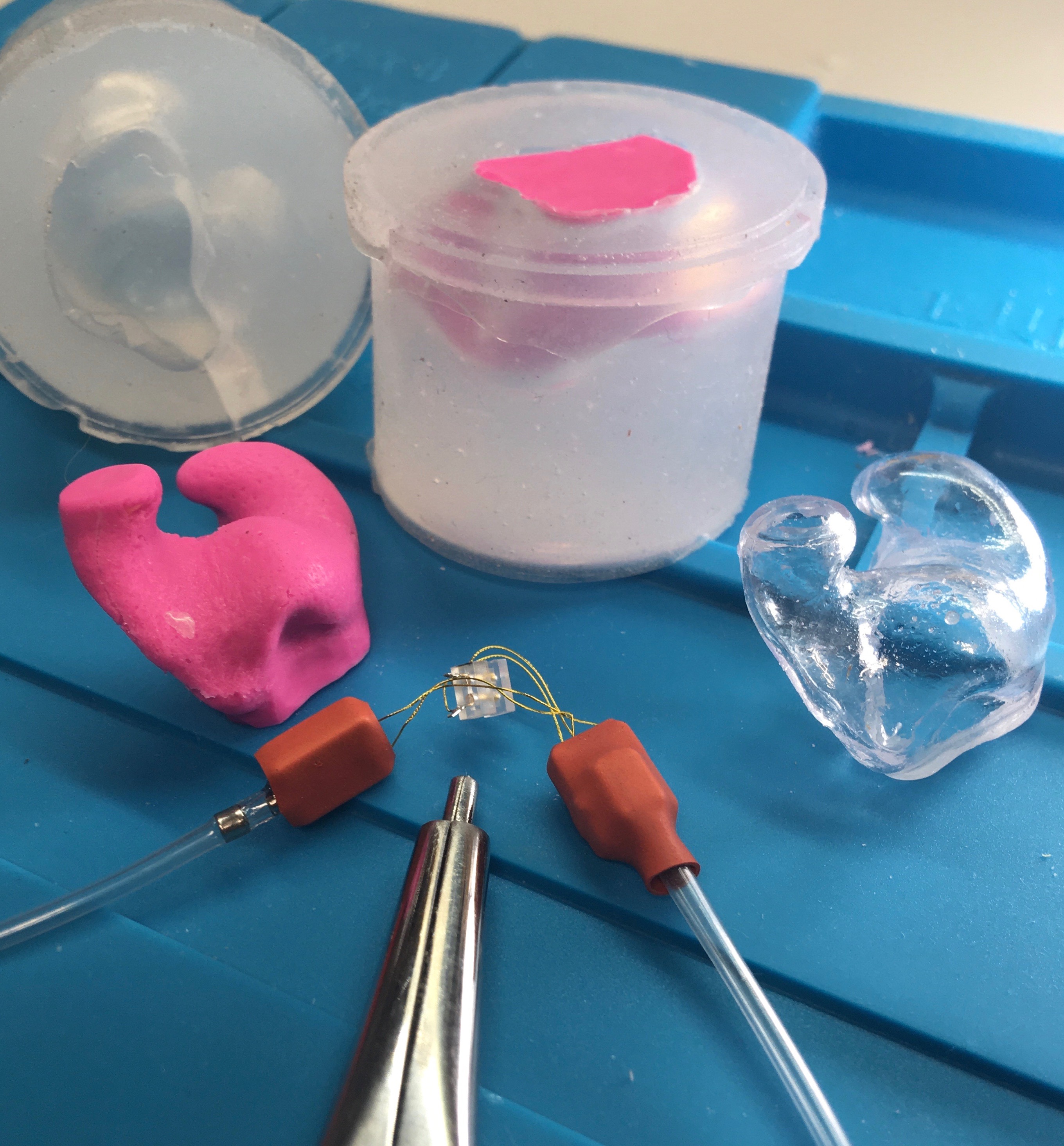 Physical ear impression, investment casting, poured shell, and insulated drivers